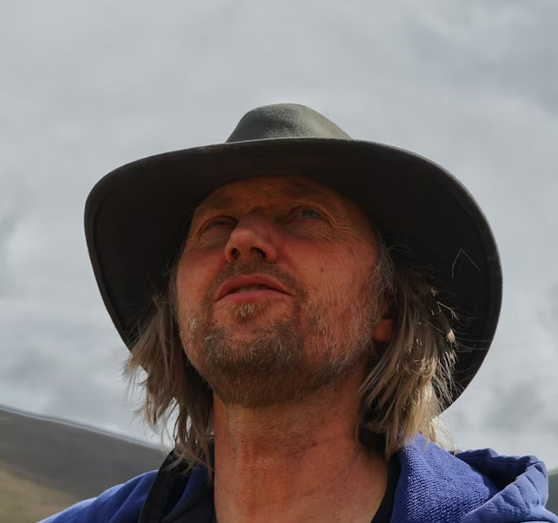 man with a beard in a dark hat